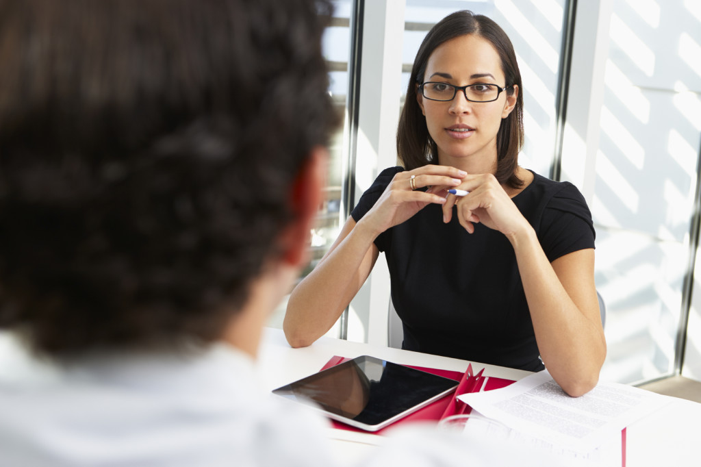 Businesswoman Interviewing Male Candidate For Job